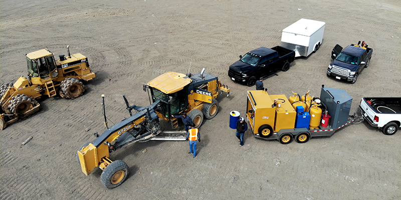 Sage Oil Vac lube trailer on the job site providing preventive maintenance on Deere and CAT equipment